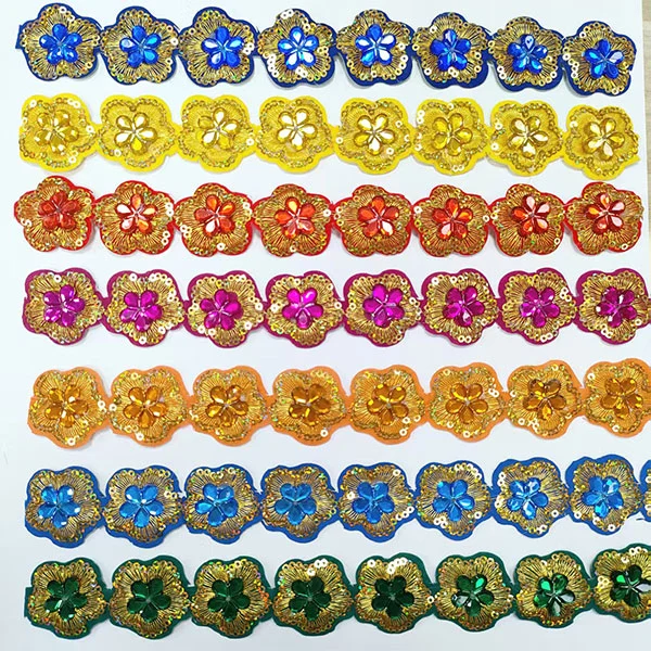 What materials are commonly used to create embroidery lace?